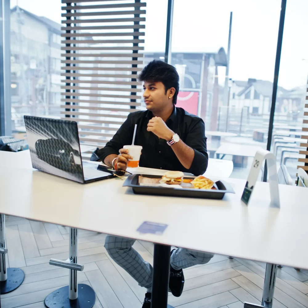 indian-man-at-fast-food-cafe-2025-02-11-18-03-58-utc indian-man-at-fast-food-cafe-2025-02-11-18-03-58-utc